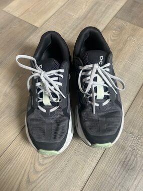 On Running Black Sneakers with Light Green Accents